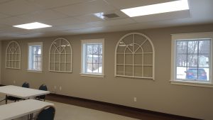 Arch windows saved from 1920 building and mounted in 2020 building